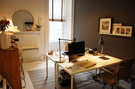 square brown wooden desk and flat screen monitor thumbnail
