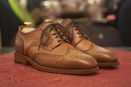pair of brown leather wingtip loafers thumbnail