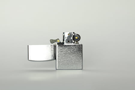 grey flip lighter on grey surface thumbnail