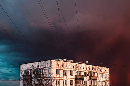 shallow focus photography of white establishment under the cloudy sky thumbnail