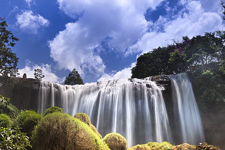 waterfalls between of trees thumbnail