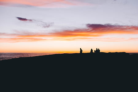 silhouette of people on beach thumbnail