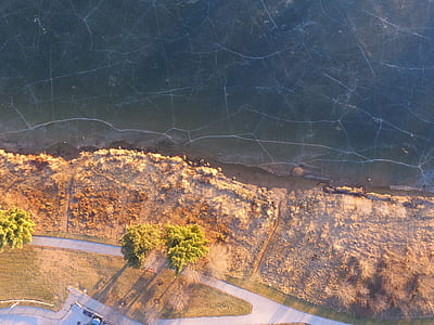 birds eye view of shore and body of water thumbnail