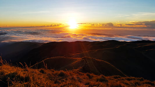 silhouette photo of mountain during golden hour thumbnail