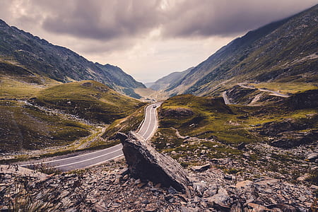 Black Car on Road Near Mountains thumbnail