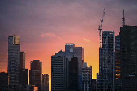 high-rise buildings under orange sky thumbnail