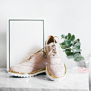 pair of pink oxford wingtip shoes thumbnail