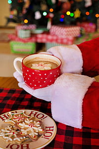 person holding filled red cup thumbnail
