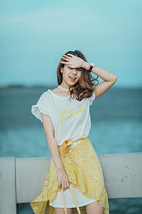 Woman Wearing White and Yellow Scoop-neck Mini Dress thumbnail