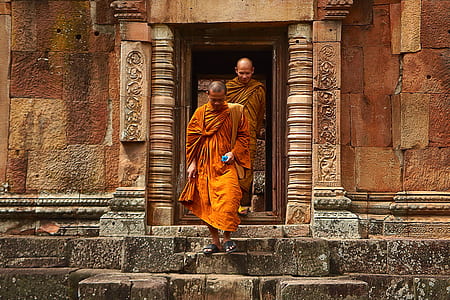 Two Monk in Orange Robe Walking Down the Concrete Stairs thumbnail