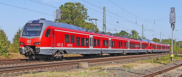 red and gray train on railway thumbnail