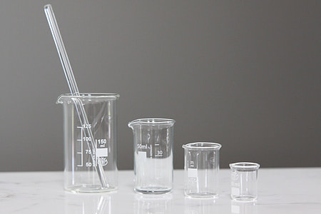 four beakers on top of white marble top thumbnail