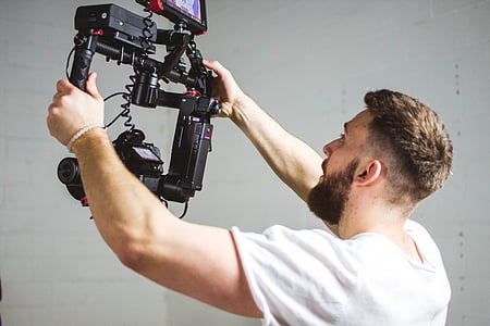 man holding camera stabilizer thumbnail