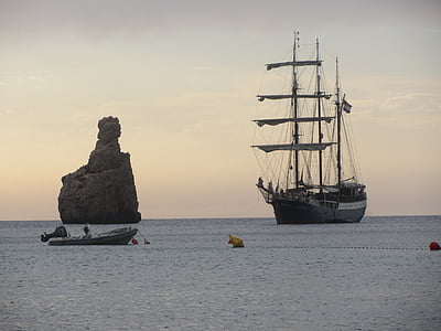 black ship near rock thumbnail
