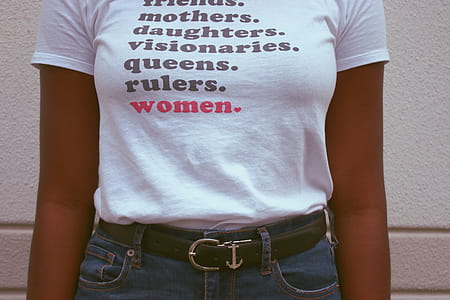 Woman Wearing White T-shirt and Blue Denim Bottoms thumbnail