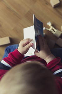 boy holding storybook thumbnail