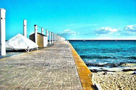 body of water beside gray concrete pathway thumbnail