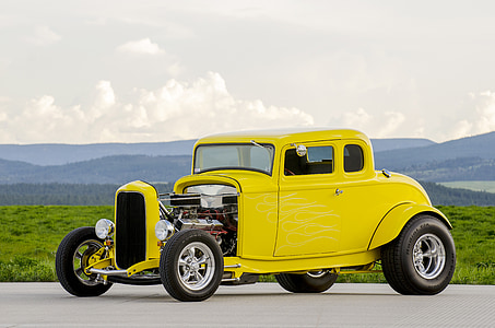 classic yellow vehicle parked on gray concrete road thumbnail