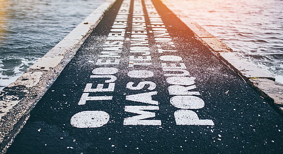 black asphalt pavement with white text overlay during daytime thumbnail