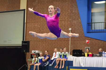 female gymnast doing tricks on air thumbnail