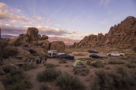 cars beside rock formations thumbnail