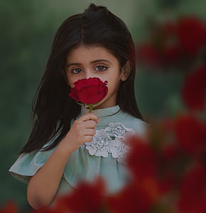 photo of girl holding red rose thumbnail