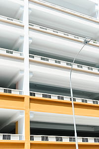 low-angle photography of white and brown concrete building thumbnail