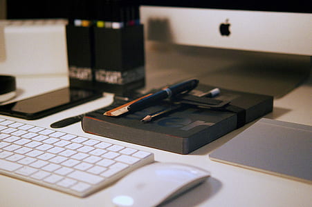 white apple magic keyboard and mouse on top of white desk thumbnail