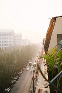 brown high rise building under white sky thumbnail