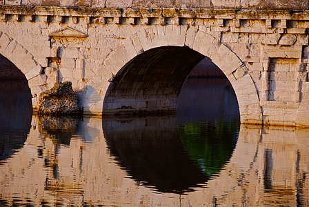 mirror photography of brown bricked bridge thumbnail