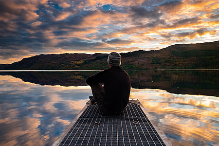person sitting on dock thumbnail