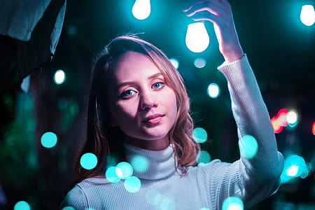 woman holding blue lightbulb thumbnail