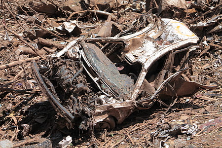 wrecked rusty vehicle on junk yard thumbnail