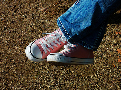 person wearing pink-and-white low-top sneakers thumbnail