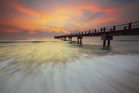 brown dock in body of water thumbnail