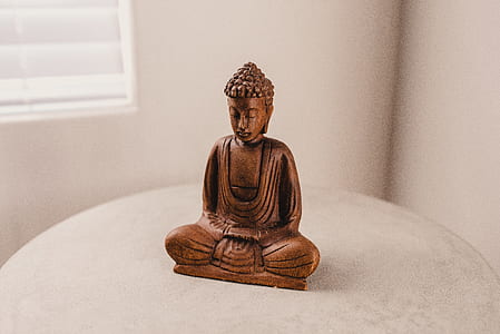 brass-colored buddha figurine thumbnail