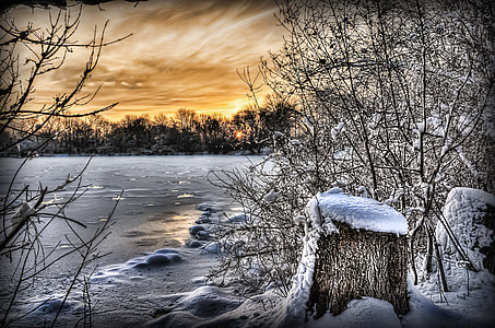 photo of frozen lake during golden hour thumbnail