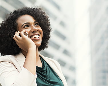 woman calling phone while smiling thumbnail