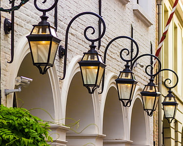 five turned-on black outdoor lanterns thumbnail