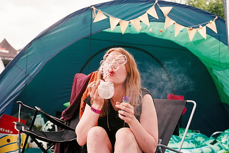 woman sitting on chair playing bubbles thumbnail