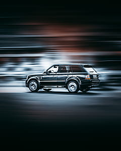 time lapse photography of black Land Rover Range Rover SUV on road thumbnail