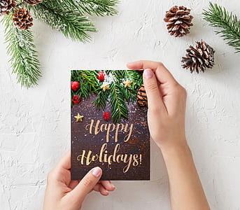 person holding Happy Holidays greetings card thumbnail