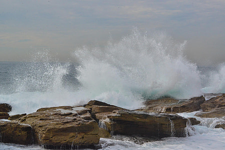 waves of water splashed on rock thumbnail