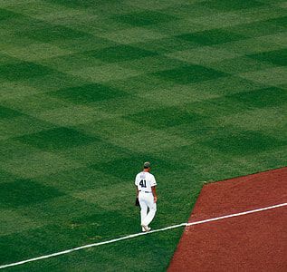 baseball player standing on the field thumbnail