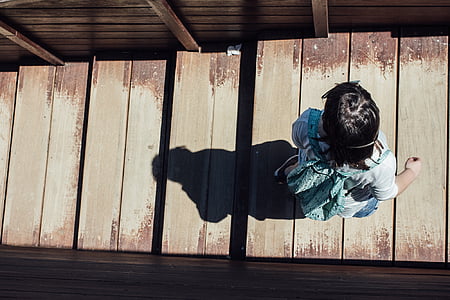girl standing on wooden floor thumbnail