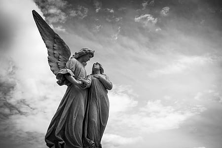 female angel and woman statue thumbnail