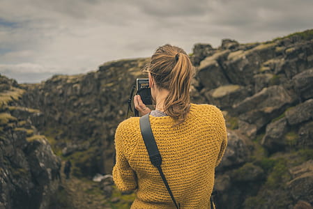 woman holding camera thumbnail