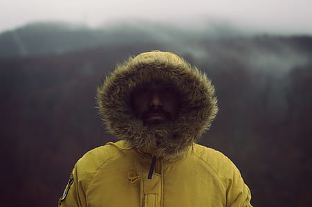 man wearing fur-lined hooded jacket thumbnail
