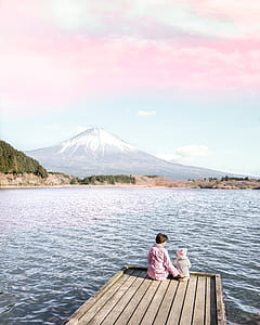 two children sitting on dock thumbnail