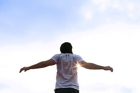 Runner Stretching Arms In Sun Photo thumbnail